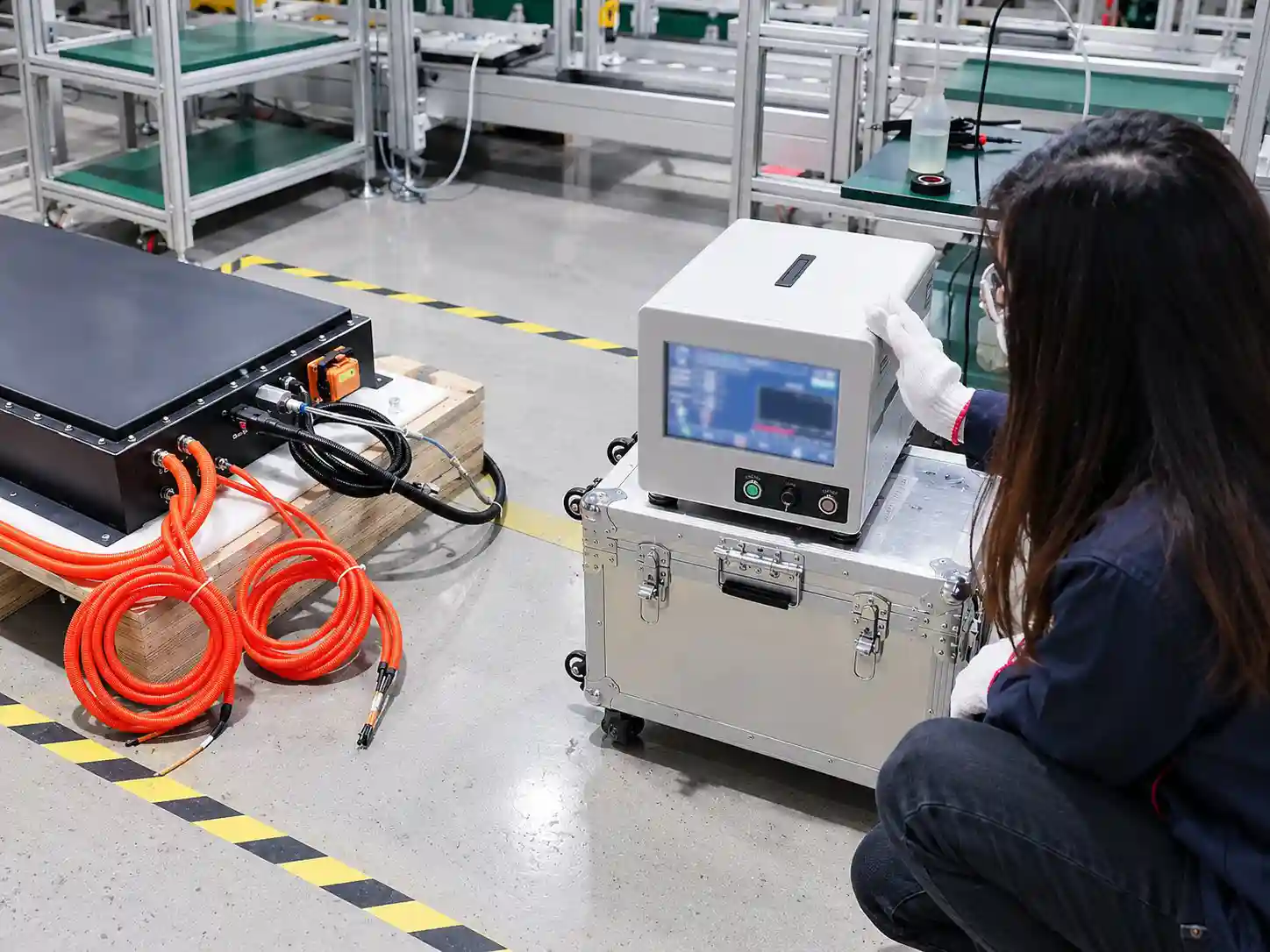 Battery enclosure connected to leak-check equipment