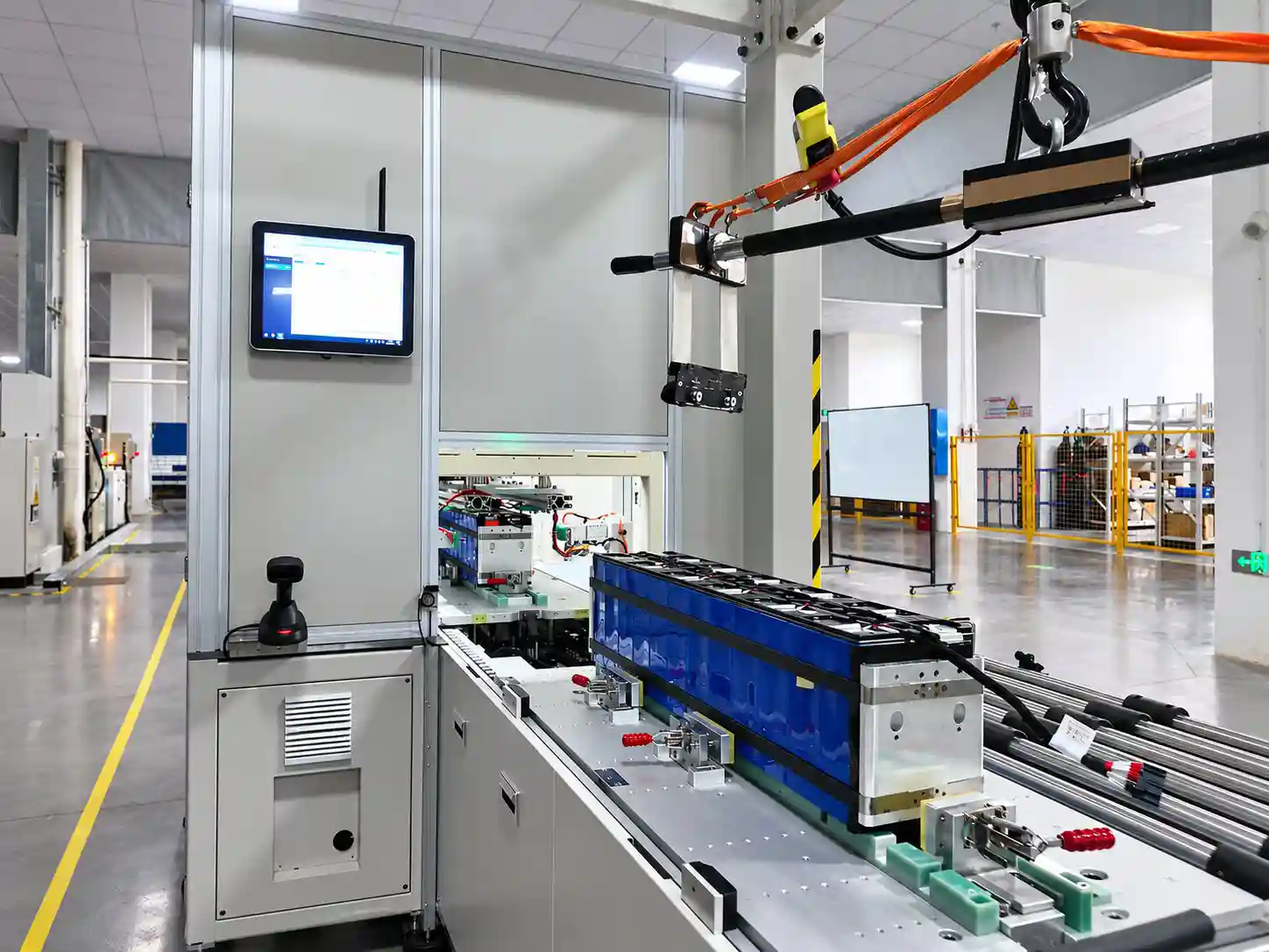 Technician working at a battery module assembly station